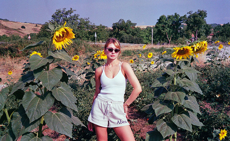 posing with sunflowers