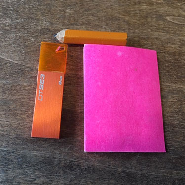 paper pencil and USB flash drive