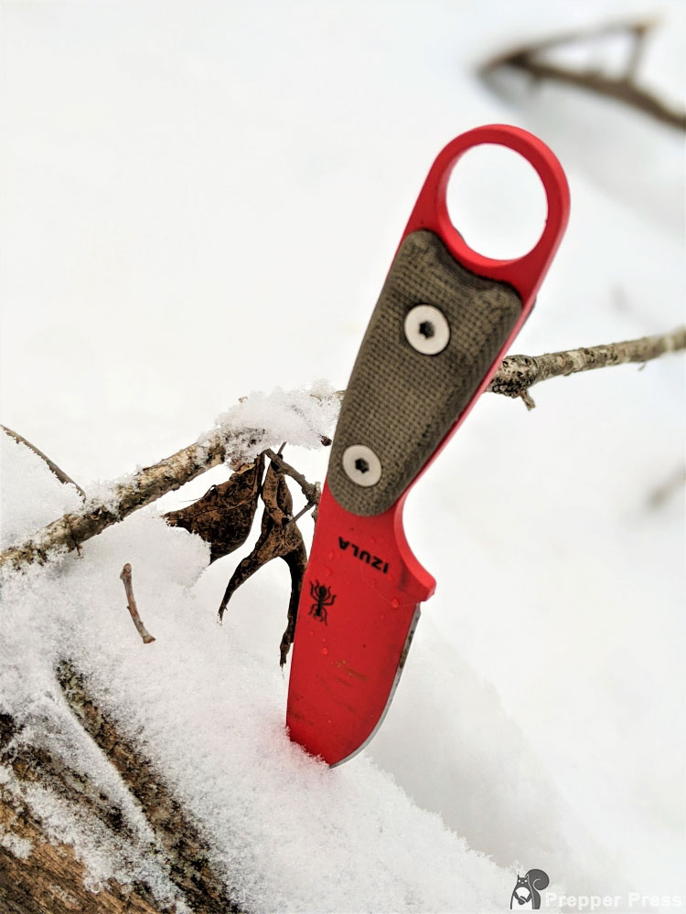ESEE izula survival neck knife in snow outdoors