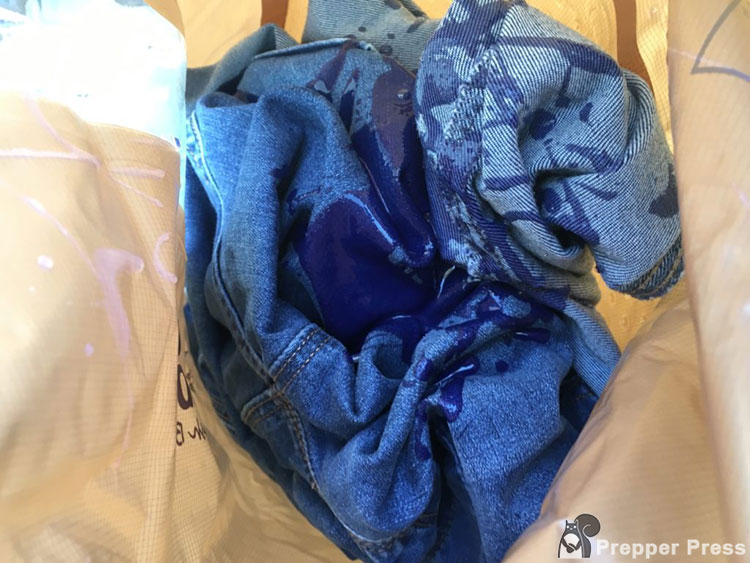 clothes in Scrubba with detergent