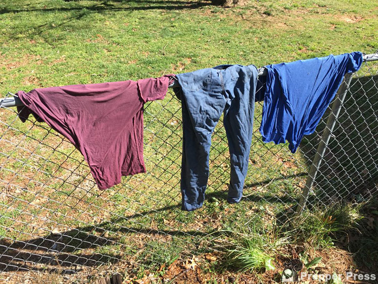 clothes drying on fence