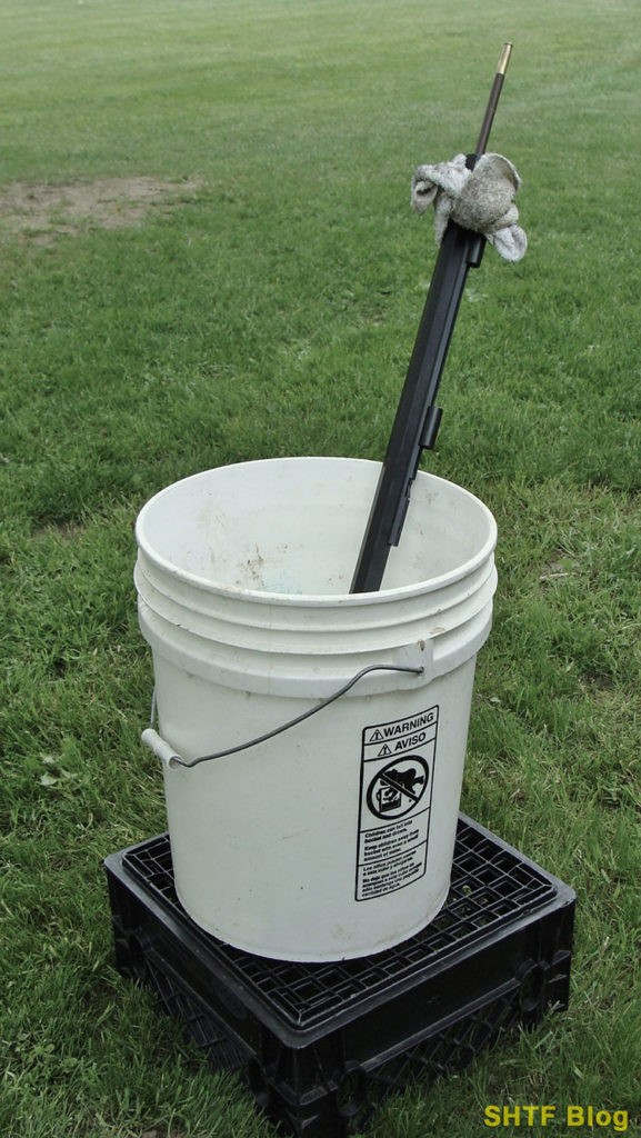 cleaning barrel in a bucket
