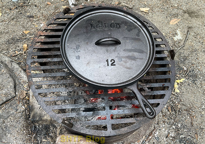 covered skillet over fire