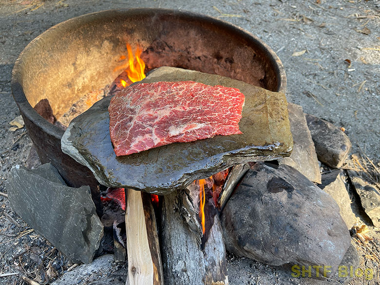 steak on a stone cooking