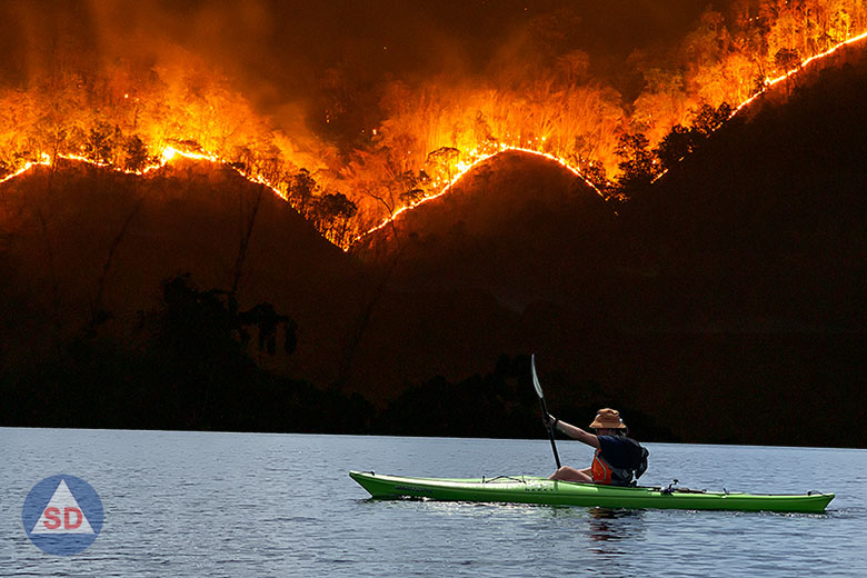 kayaking with wildfires in mountains