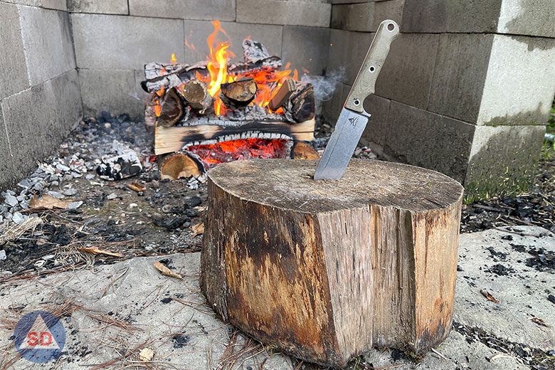 White River Firecraft FC5 knife in front of a fire